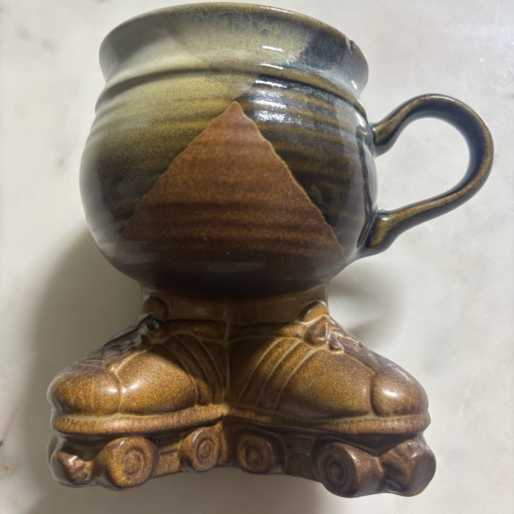 1979 Muddy Waters Pottery ceramic, glazed mug with legs and roller skates